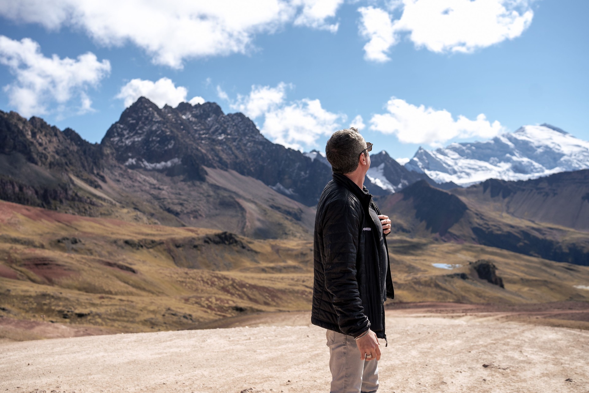 Shaun Southworth looking across a snowcapped mountain range in Peru